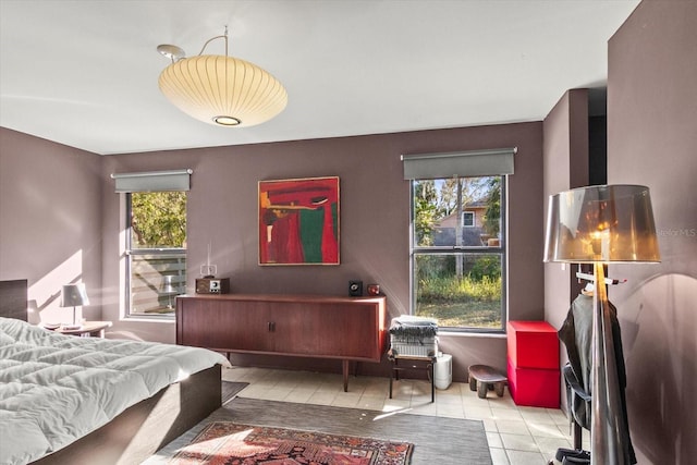 bedroom with light tile patterned floors