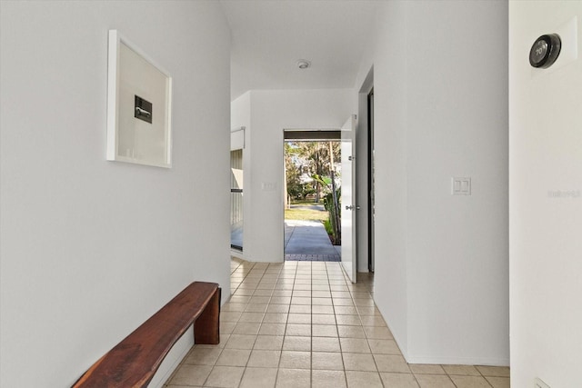 hallway with light tile patterned floors