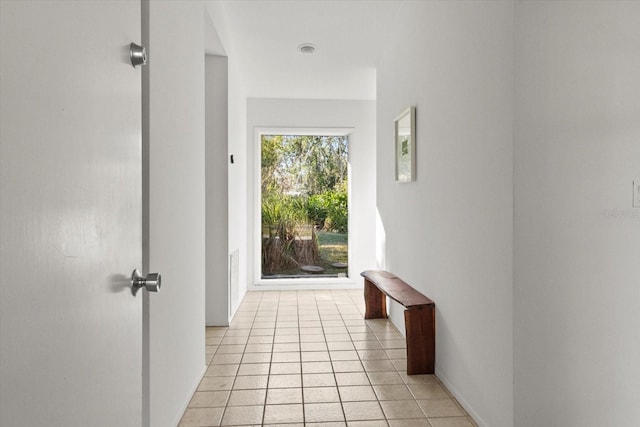 corridor with light tile patterned floors