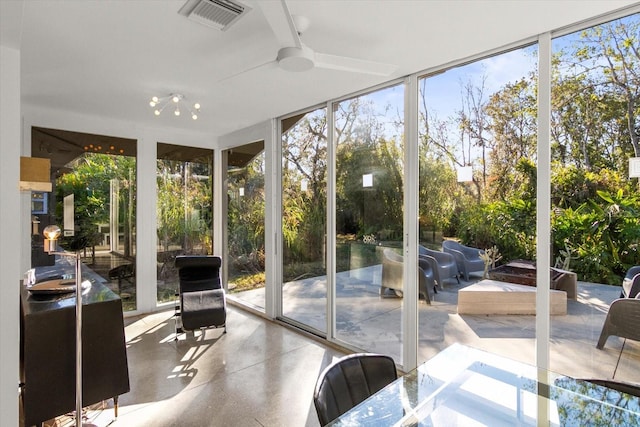 sunroom featuring a wealth of natural light and ceiling fan