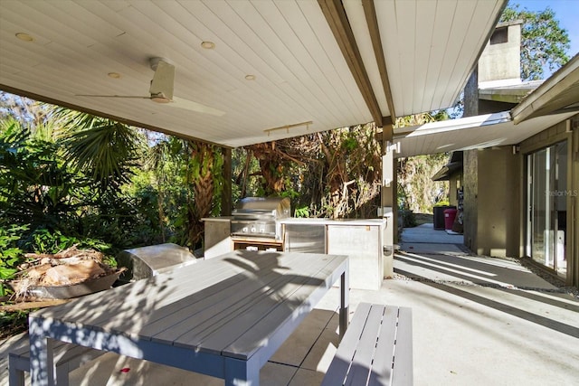 view of patio featuring area for grilling, a grill, and ceiling fan