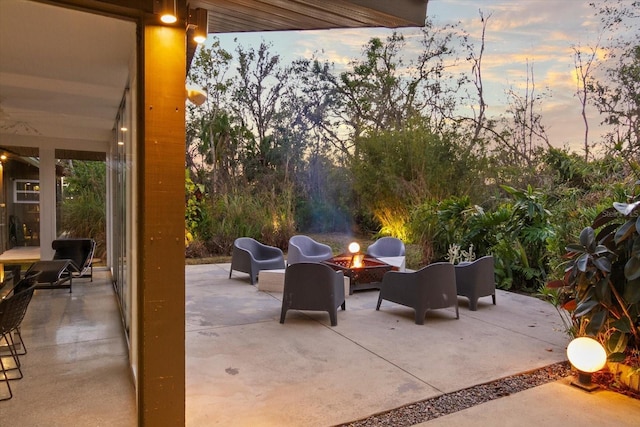 patio terrace at dusk with an outdoor fire pit