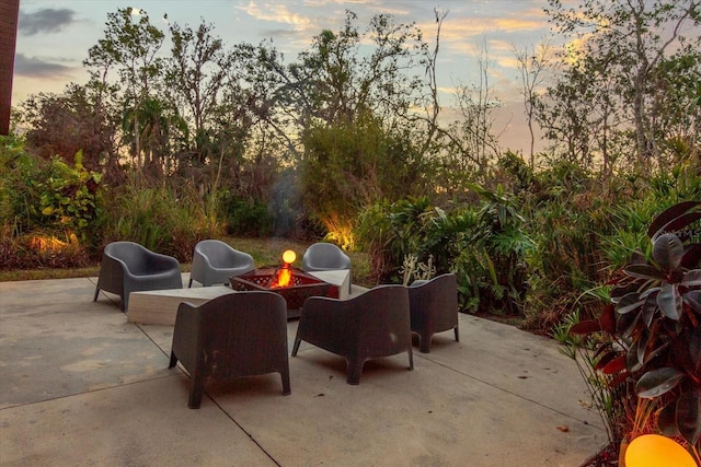 patio terrace at dusk with an outdoor fire pit