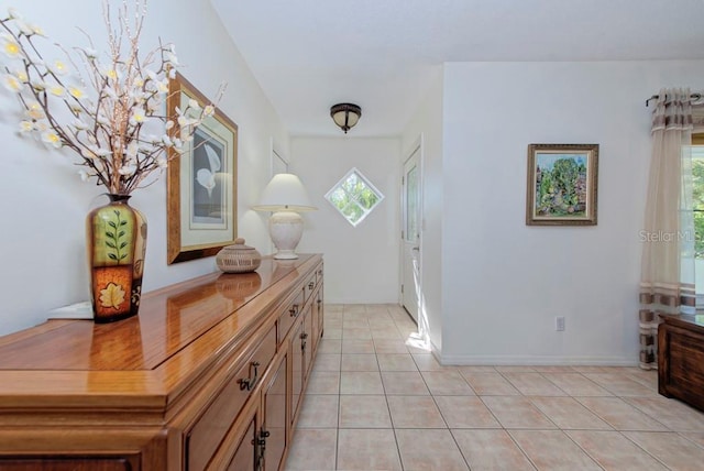 entrance foyer with a healthy amount of sunlight and light tile patterned flooring