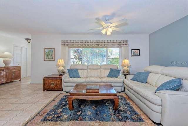 living room with ceiling fan and light tile patterned floors