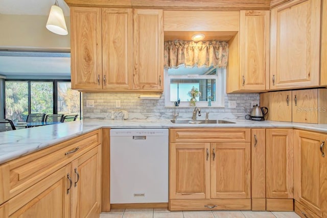 kitchen with hanging light fixtures, dishwasher, plenty of natural light, and sink