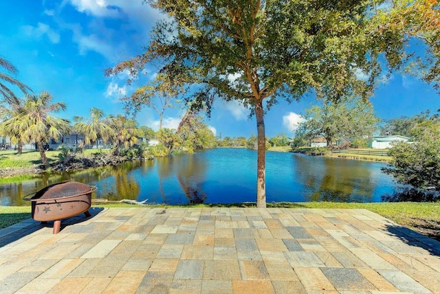 property view of water featuring an outdoor fire pit