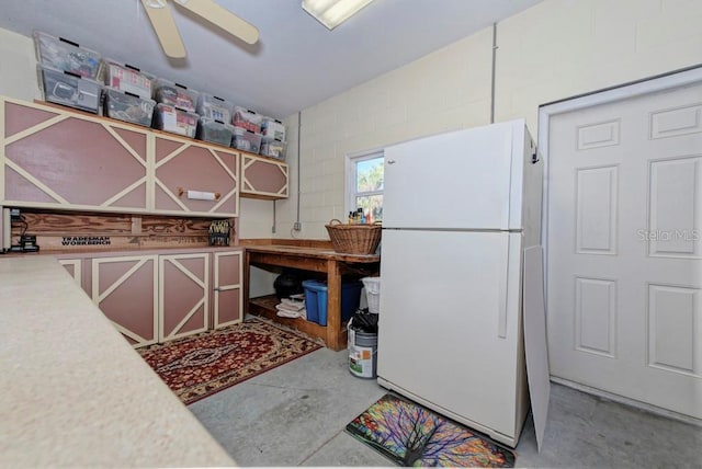 kitchen featuring white fridge and ceiling fan