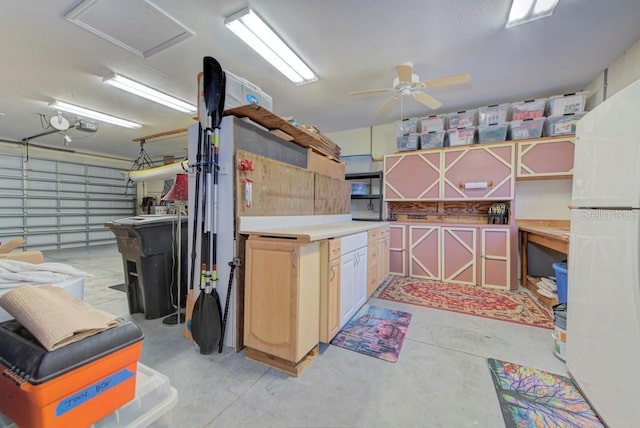 kitchen with ceiling fan and white fridge