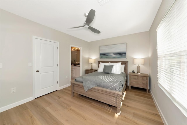 bedroom with ceiling fan, connected bathroom, and light hardwood / wood-style floors