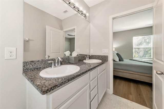 bathroom featuring vanity and hardwood / wood-style flooring