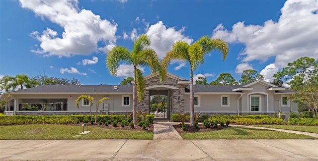 ranch-style house with a front yard