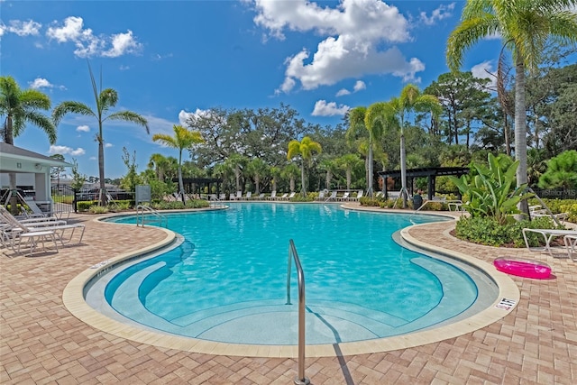 view of pool with a patio area and a pergola