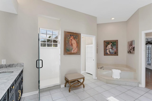 bathroom featuring tile patterned flooring, vanity, and plus walk in shower