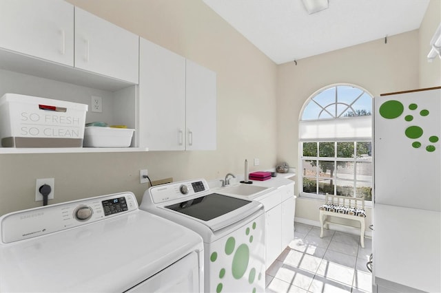 washroom featuring cabinets, washer and clothes dryer, sink, and light tile patterned floors