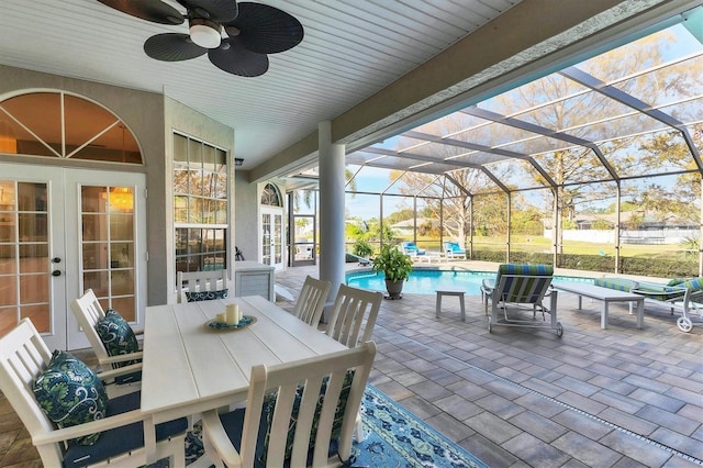 view of patio with glass enclosure