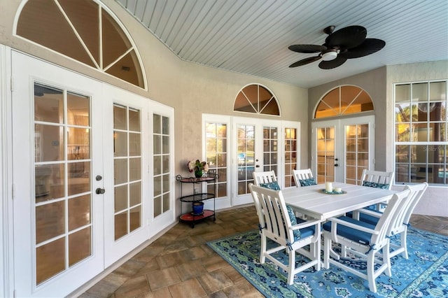 sunroom / solarium with wood ceiling, french doors, and ceiling fan