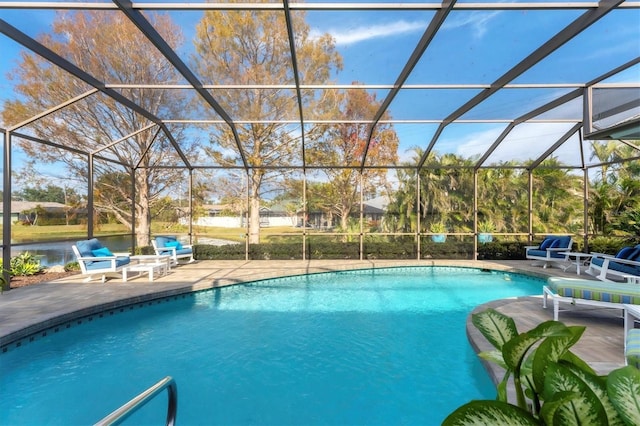 view of swimming pool featuring a lanai, a patio, and a water view