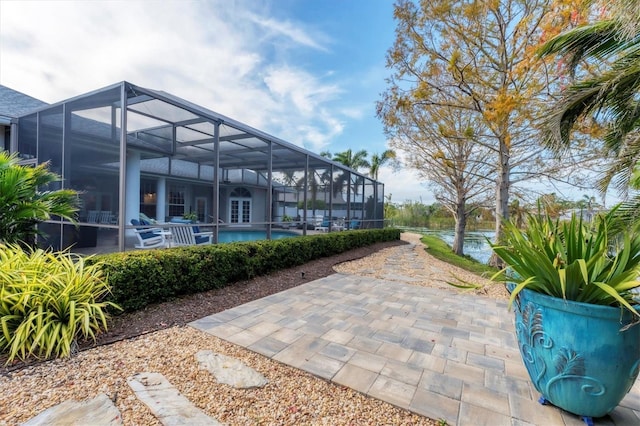 view of patio / terrace with a lanai