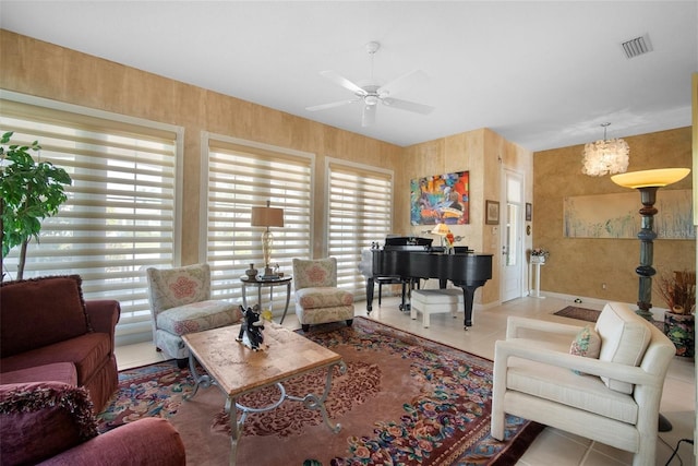 living room with ceiling fan and tile patterned flooring