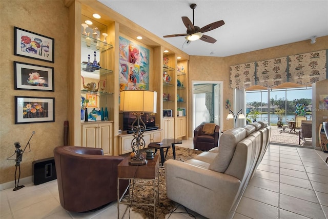 living room featuring light tile patterned flooring, ceiling fan, and built in features