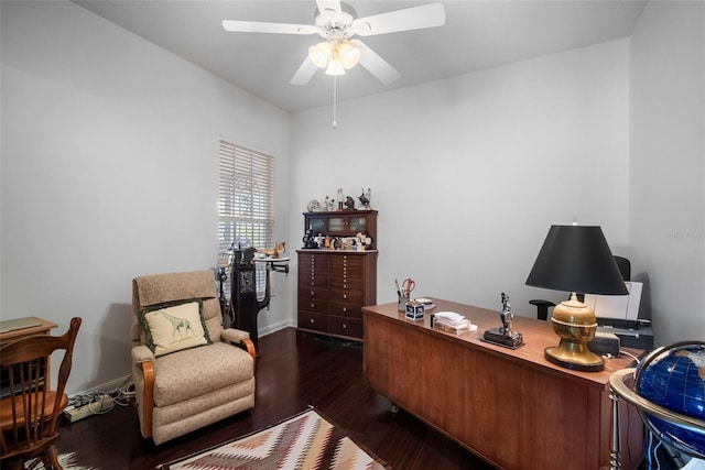 home office featuring dark wood-type flooring and ceiling fan