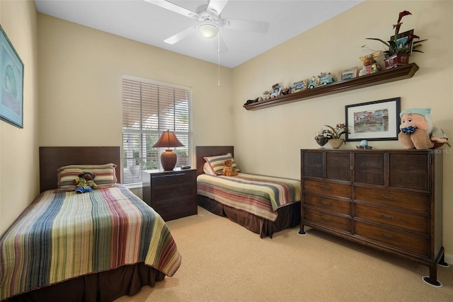 bedroom with ceiling fan and carpet floors