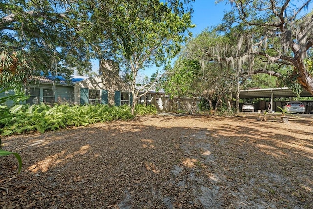 view of yard with a carport