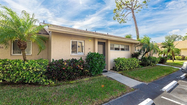 ranch-style home with a front yard