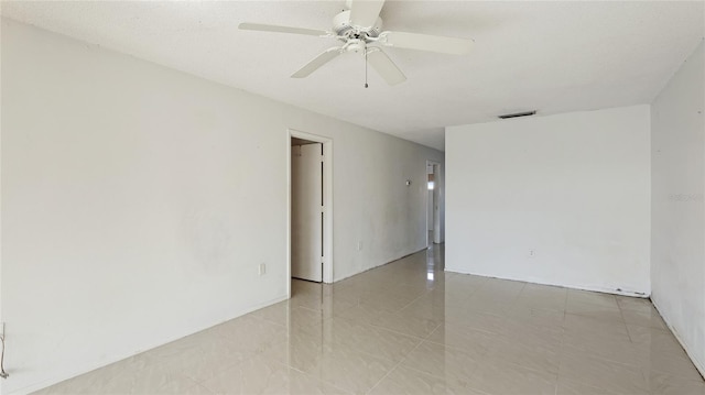 unfurnished room featuring ceiling fan