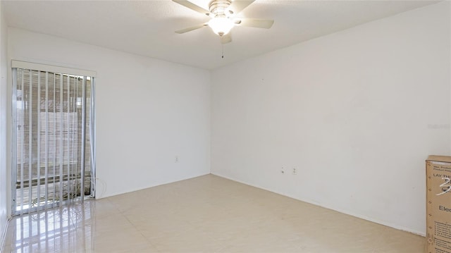 spare room featuring ceiling fan