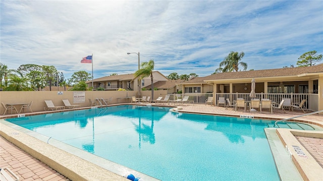 view of swimming pool with a patio area