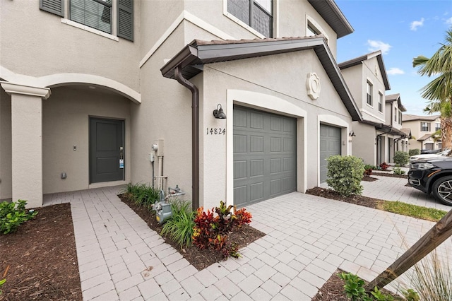 entrance to property featuring a garage