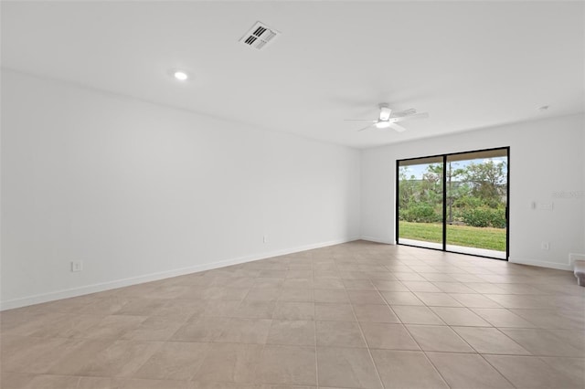 unfurnished room with light tile patterned floors and ceiling fan