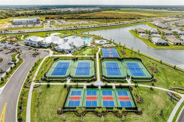 birds eye view of property with a water view