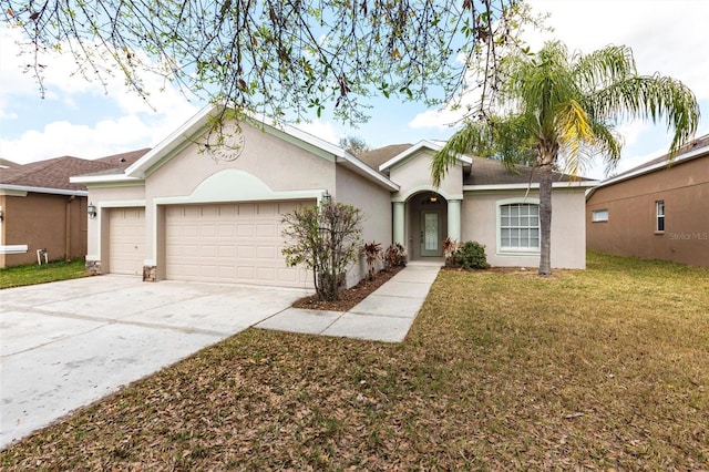 ranch-style home featuring a garage and a front lawn