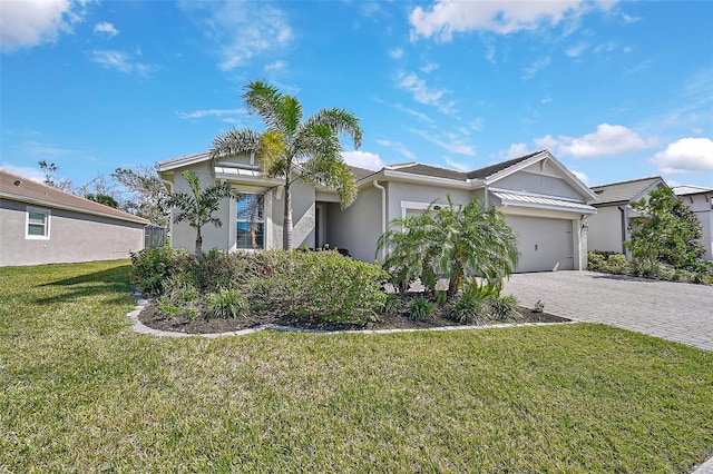 view of front of house with a garage and a front yard