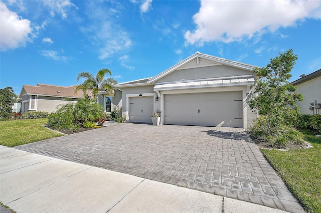 single story home with a garage and a front yard