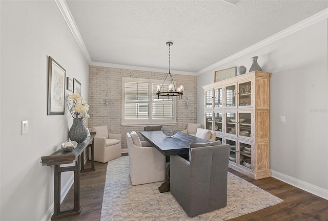 dining room with a notable chandelier, crown molding, dark wood-type flooring, and a textured ceiling