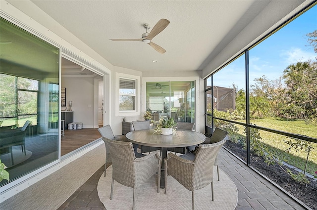 sunroom / solarium with ceiling fan