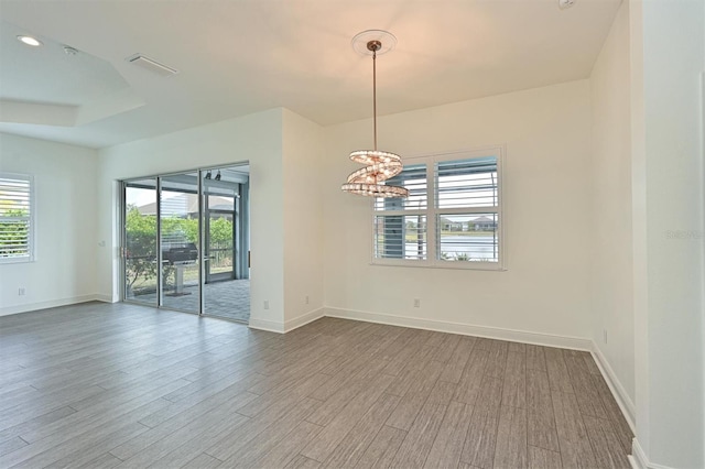 unfurnished room with hardwood / wood-style floors