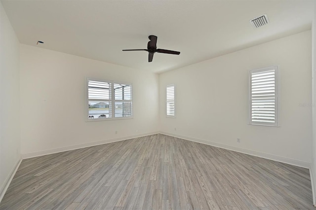 unfurnished room featuring ceiling fan and light hardwood / wood-style floors