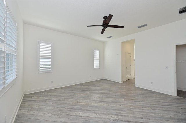 unfurnished room featuring ceiling fan and light hardwood / wood-style flooring