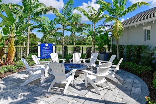 view of patio / terrace featuring an outdoor fire pit