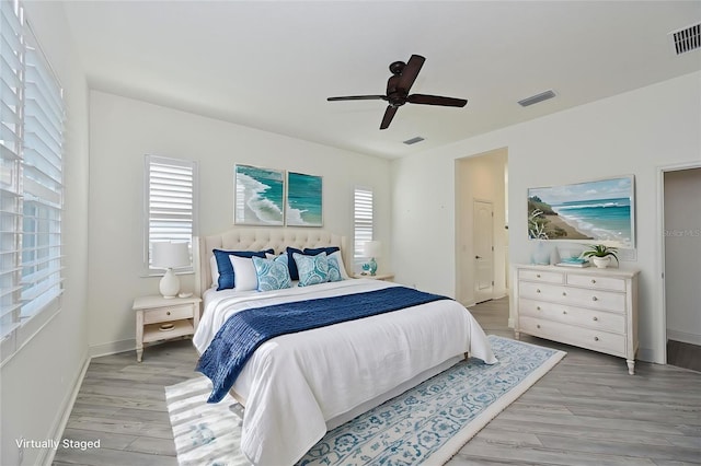 bedroom featuring ceiling fan and light hardwood / wood-style flooring