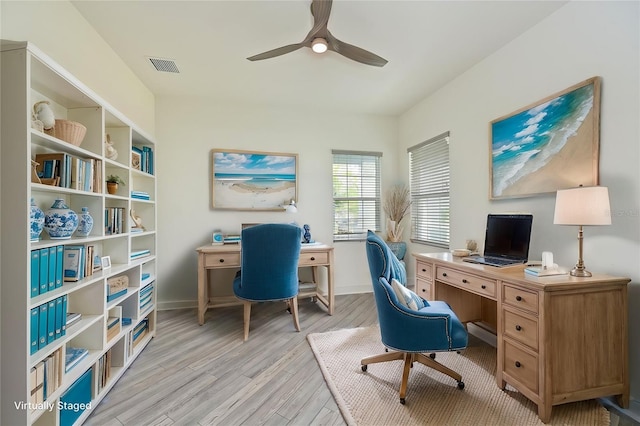 home office with ceiling fan and light hardwood / wood-style flooring