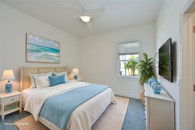 bedroom with ceiling fan and carpet flooring