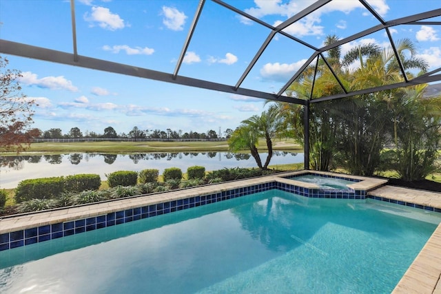 view of pool featuring an in ground hot tub, a water view, and glass enclosure