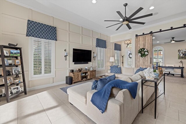 living area with a ceiling fan, recessed lighting, ornamental molding, and light tile patterned floors