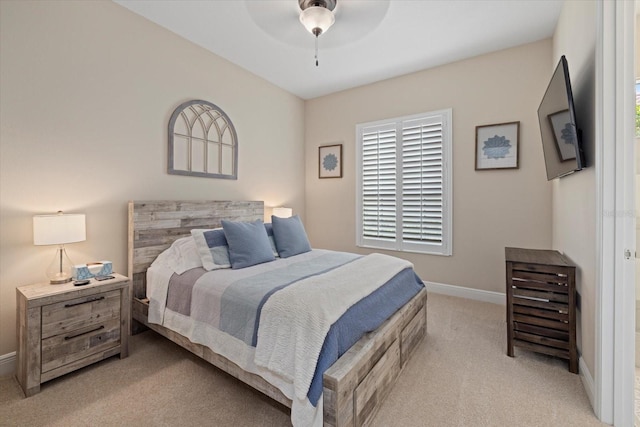 bedroom featuring carpet floors, baseboards, and a ceiling fan